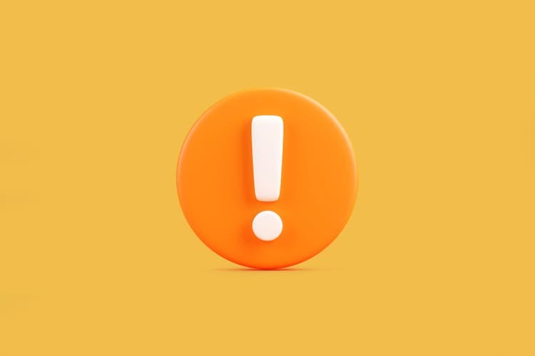 Orange Exclamation Mark Icon on Yellow