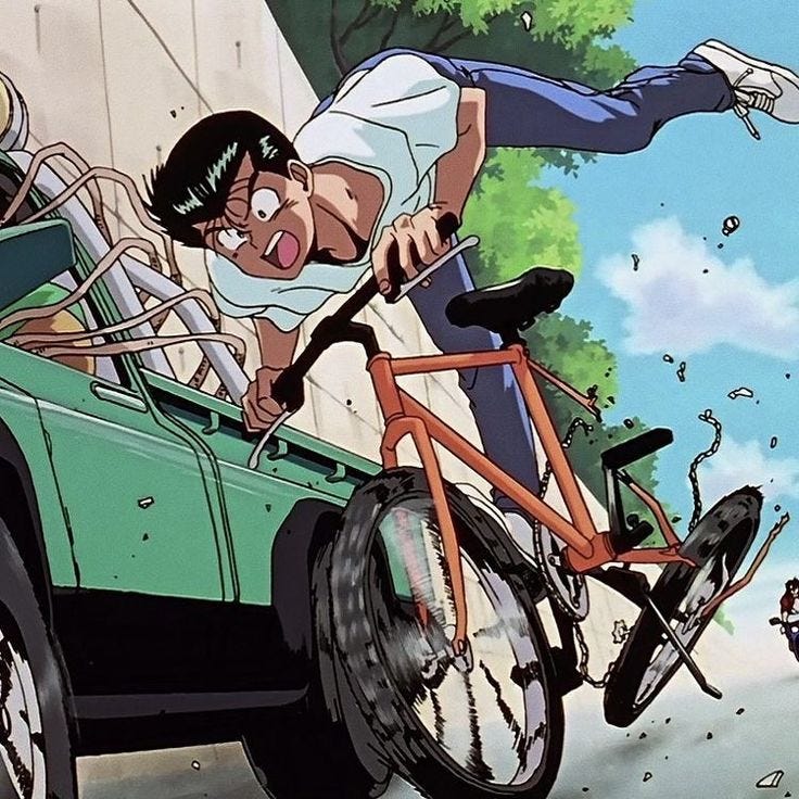 This may contain: a man riding on the back of a bike next to a green car and another person
