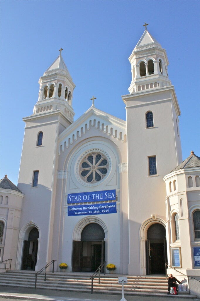 The poor wait just outside the church doors