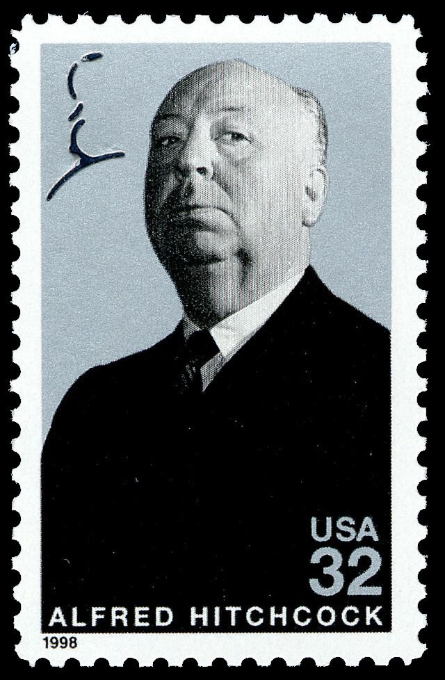 This may contain: a postage stamp with an image of a man in a suit and tie on it