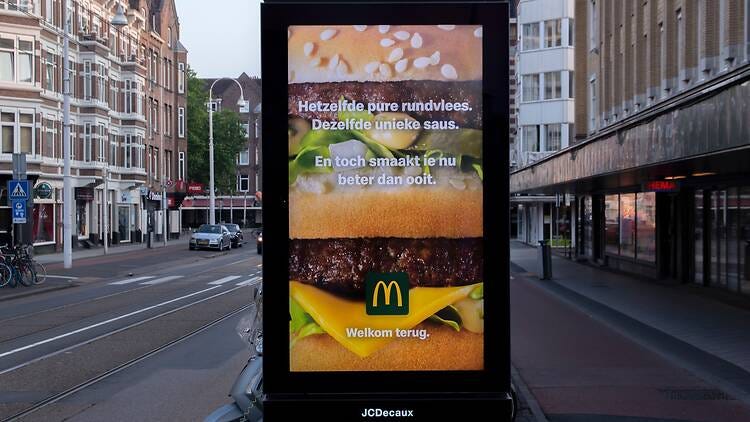 A McDonalds billboard by the side of the road in Amsterdam A McDonalds billboard by the side of the road in Amsterdam