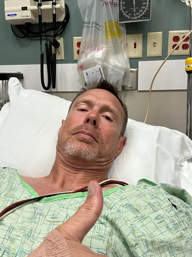 A person lying in a hospital bed

AI-generated content may be incorrect.