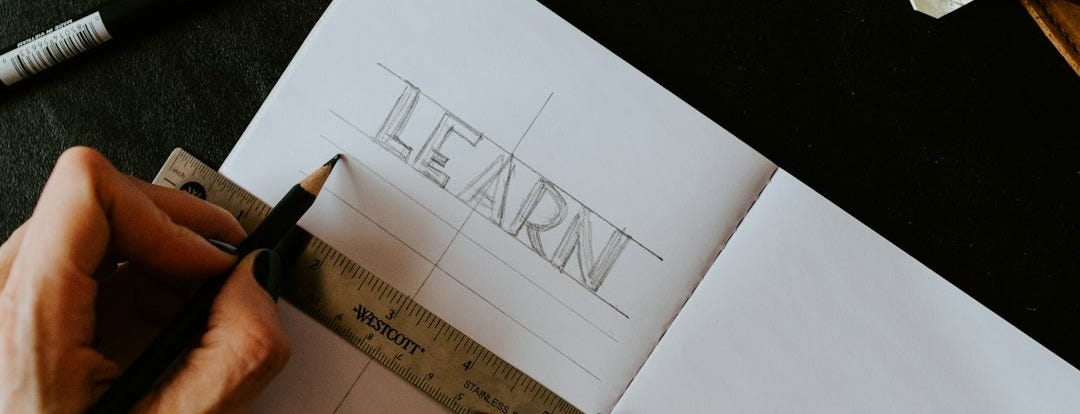 person writing on white paper