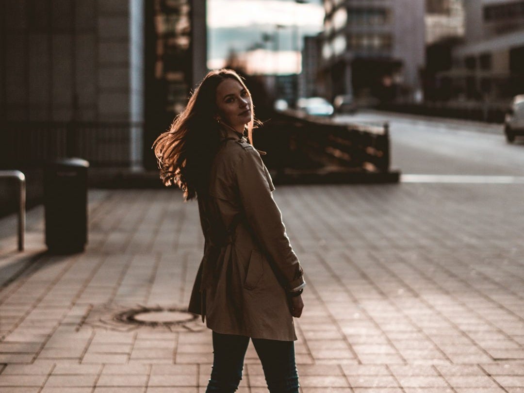woman in brown coat woman in brown coat