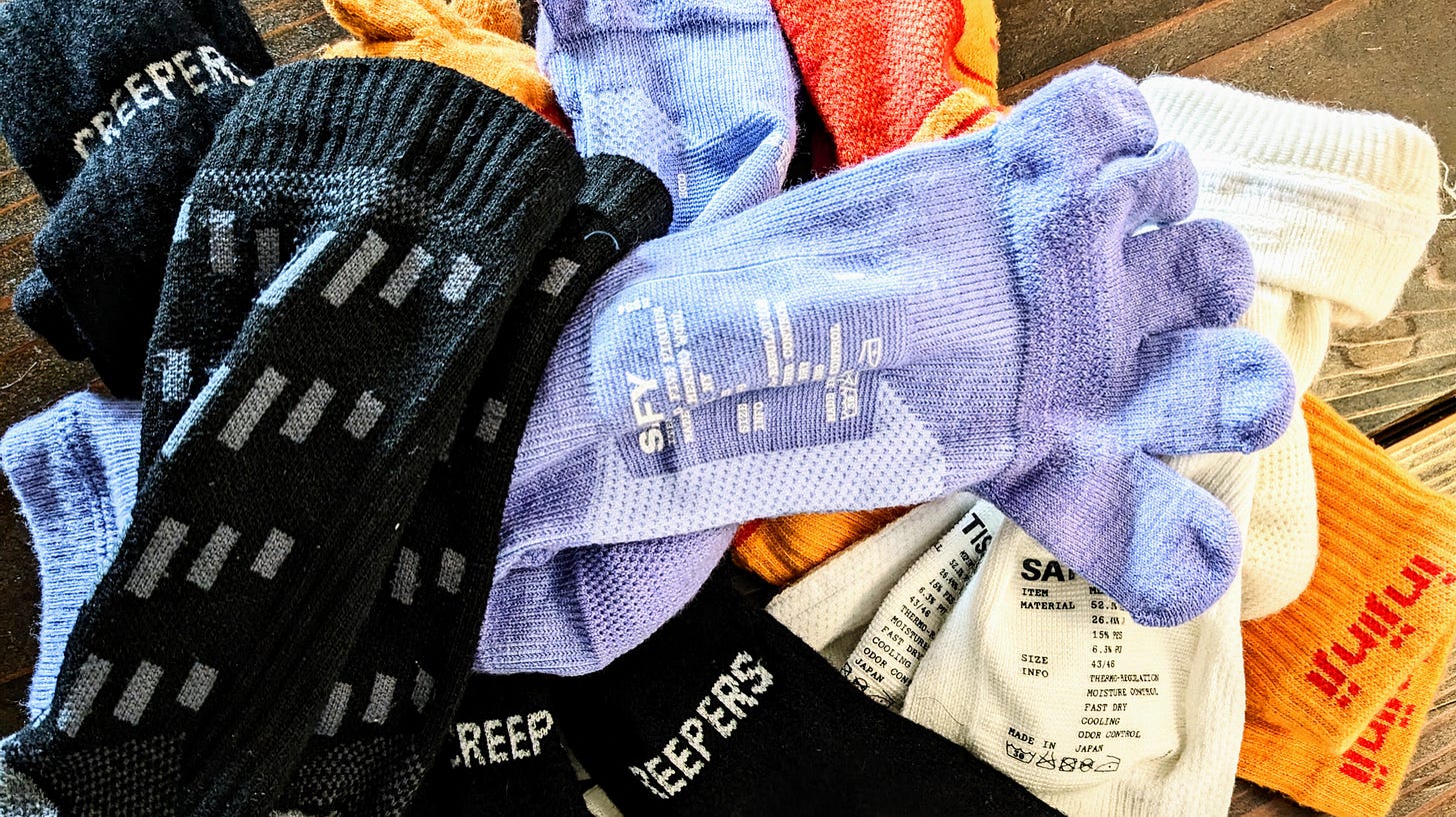 A selection of toe socks from Injinji, SATISFY, and Creepers, photgraphed on my dining table. A selection of toe socks from Injinji, SATISFY, and Creepers, photgraphed on my dining table.
