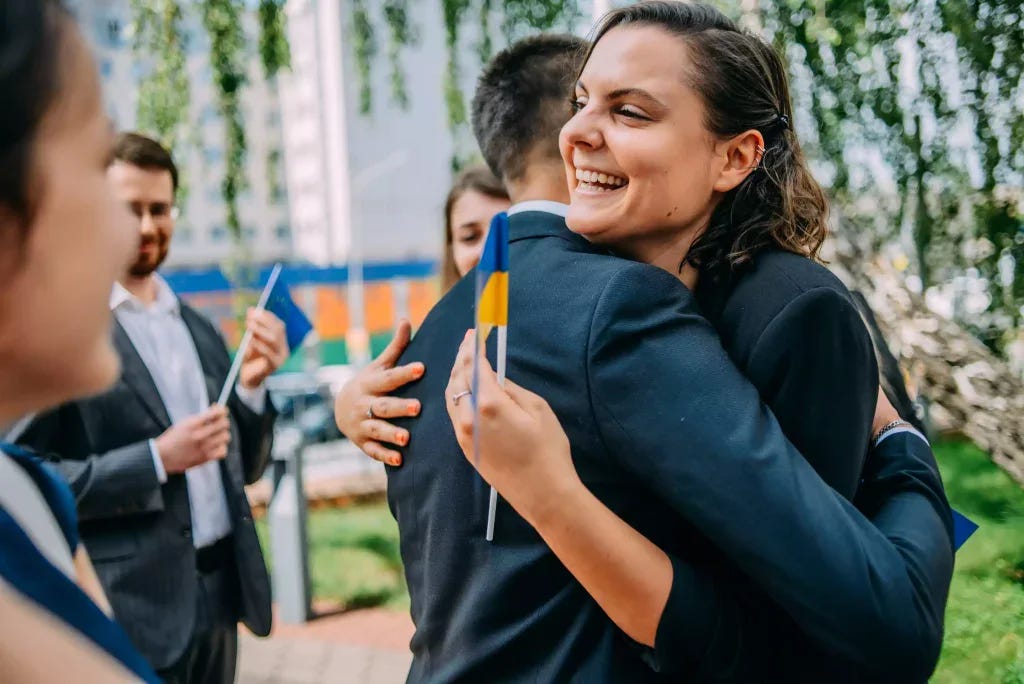 Sophie Vériter hugging a Young European Ambassador in Ukraine