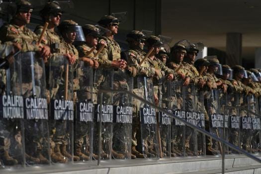 FILE – California National Guard members are positioned at the Federal Building in downtown Los Angeles, on June 10, 2025. (AP Photo/Eric Thayer, File)
