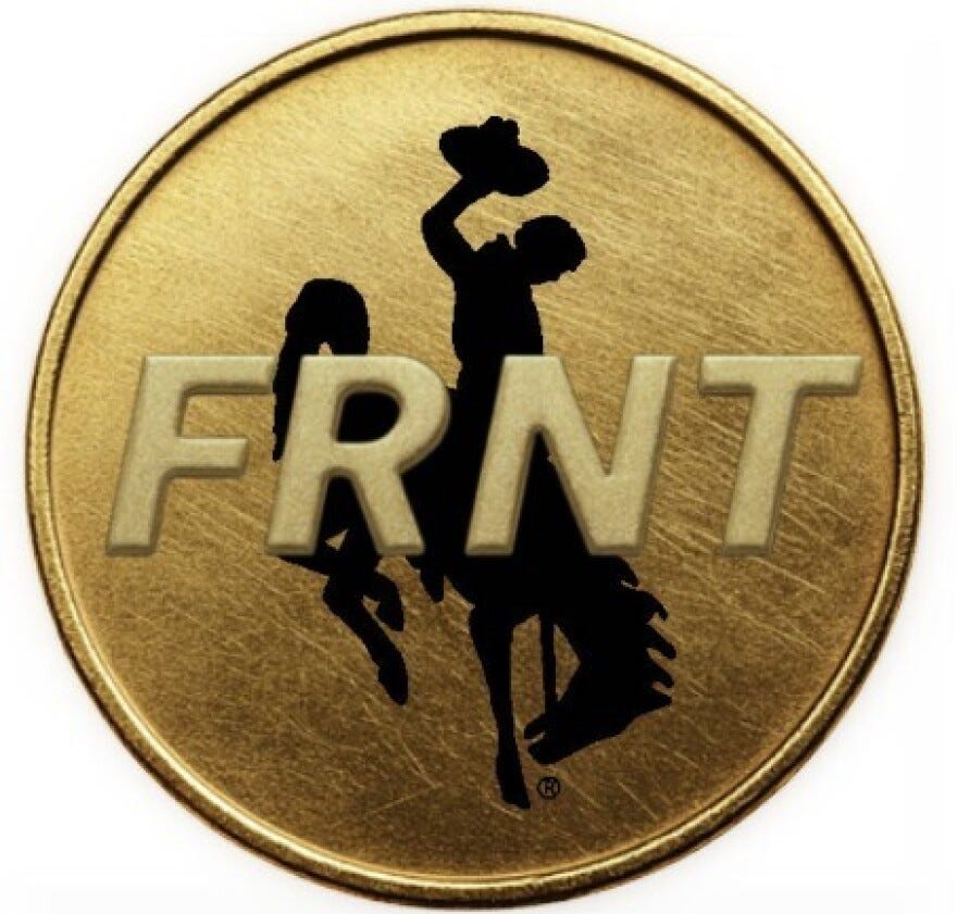 A coin with the Wyoming bucking horse on it and the letters F-R-N-T. A coin with the Wyoming bucking horse on it and the letters F-R-N-T.