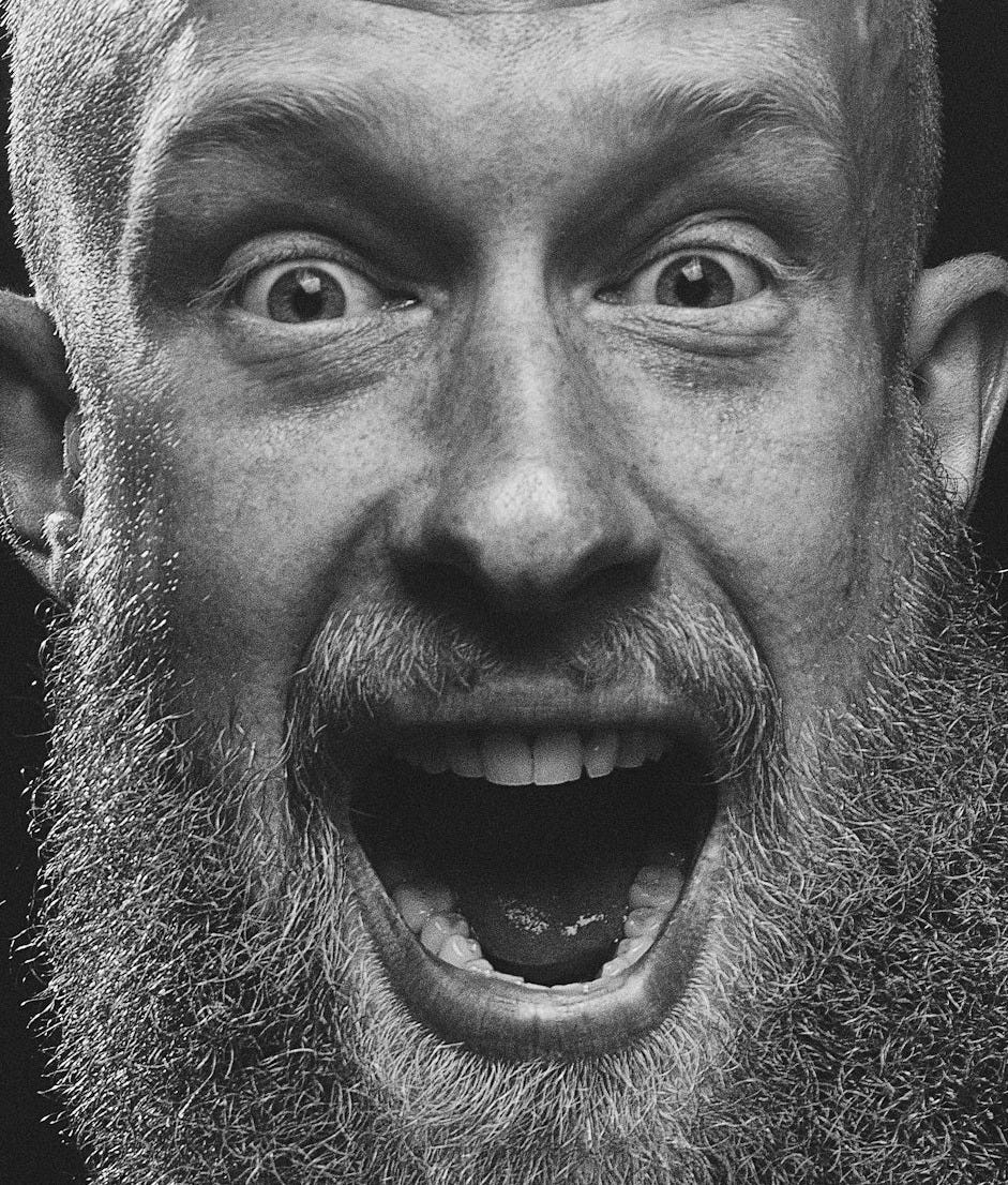 mans face in grayscale mans face in grayscale