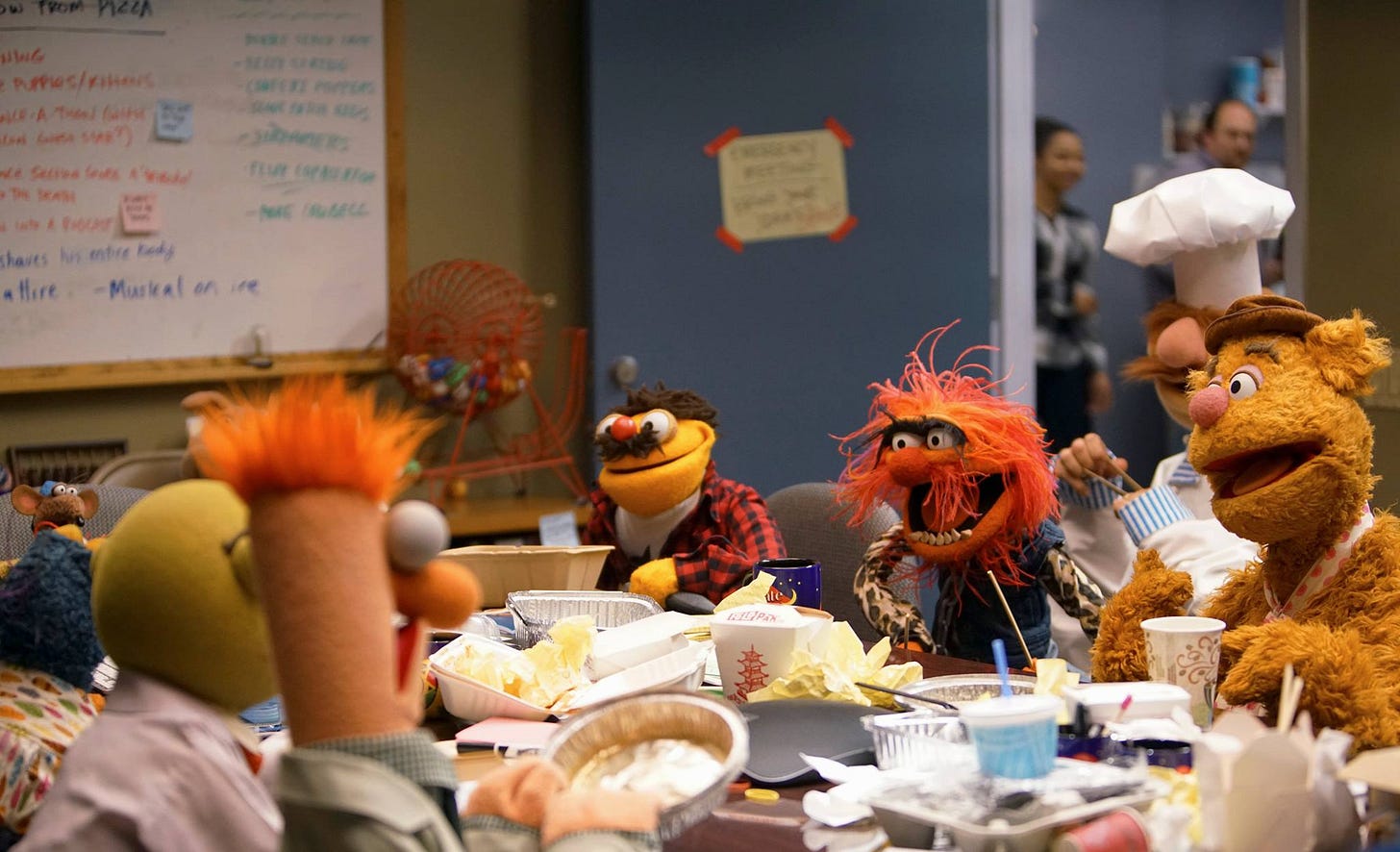 a photo of a messy table covered in empty takeout containers and trash surrounded by muppets in a conference room with a white board