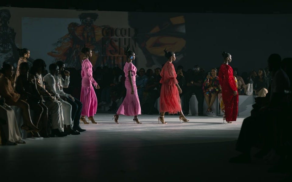 A group of women walking down a runway