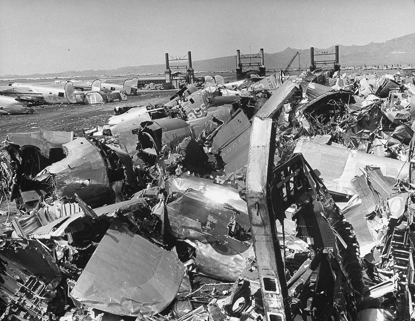 A towering pile of aluminum is all that remains of a once-proud aircraft at Kingman Air Force Base, 1947. A towering pile of aluminum is all that remains of a once-proud aircraft at Kingman Air Force Base, 1947.