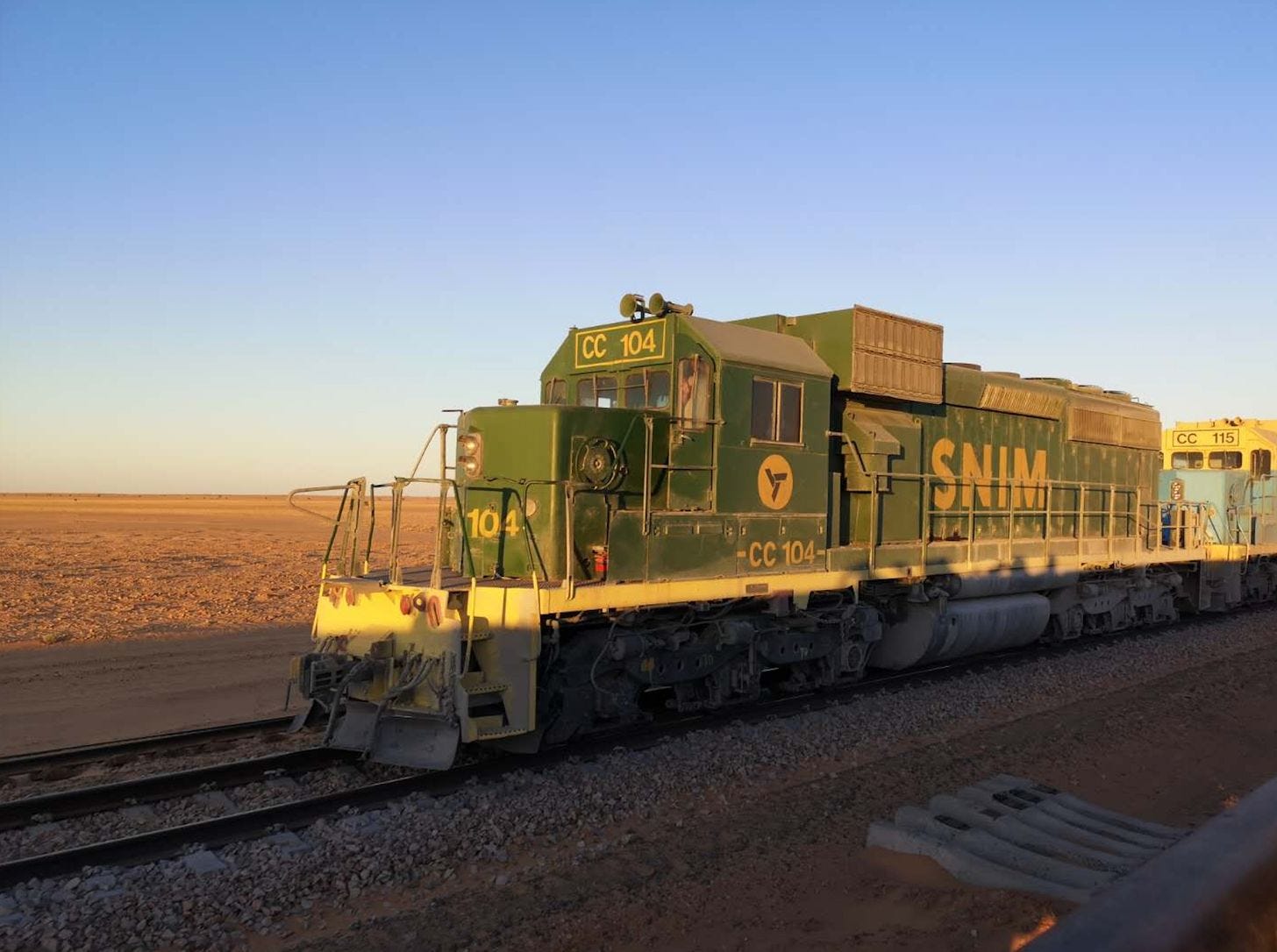 Adventure traveler riding the Mauritania Train across the Sahara Desert. Adventure traveler riding the Mauritania Train across the Sahara Desert.
