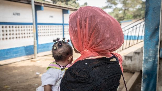 Mariatu, pictured with the baby she gave birth to upon returning to Sierra Leone from Kuwait. Photograph: Sally Hayden