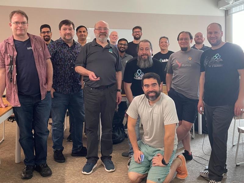 A group photo of the Developer U trainers and trainees, some wearing EDB shirts, or references to open source software. A group photo of the Developer U trainers and trainees, some wearing EDB shirts, or references to open source software.