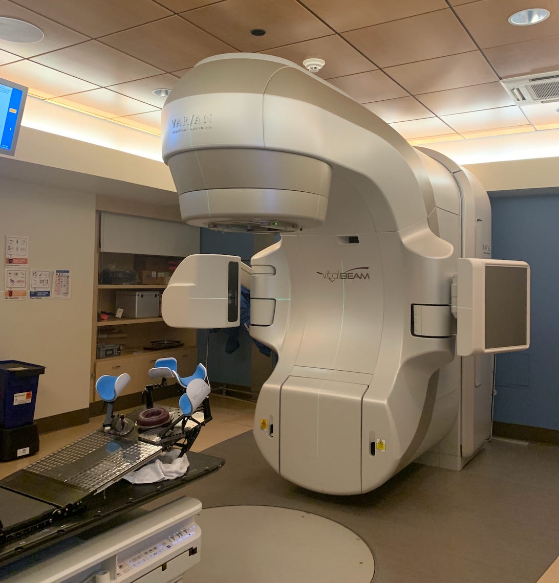 Radiation machine in the distance in a hospital exam room. 