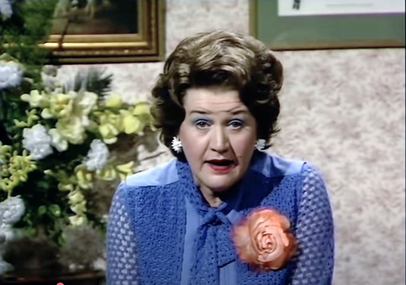 Patricia Routledge as Kitty, spouting forth