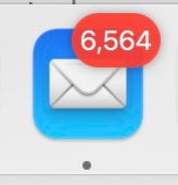 A screenshot of the Apple Mail app logo with a red bubble above it with the number "6,564" in it, indicating a LOT of unread emails