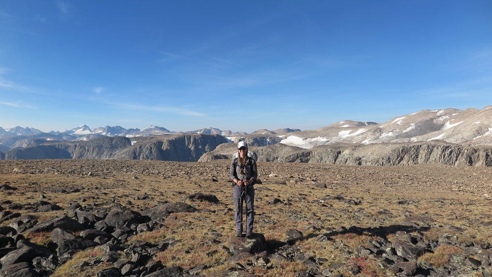 At the start of Goat Flats, with the Wind River Range behind me. Gannett Peak is visible off to the left in the distance (we crossed that glacier below it!). At the start of Goat Flats, with the Wind River Range behind me. Gannett Peak is visible off to the left in the distance (we crossed that glacier below it!).