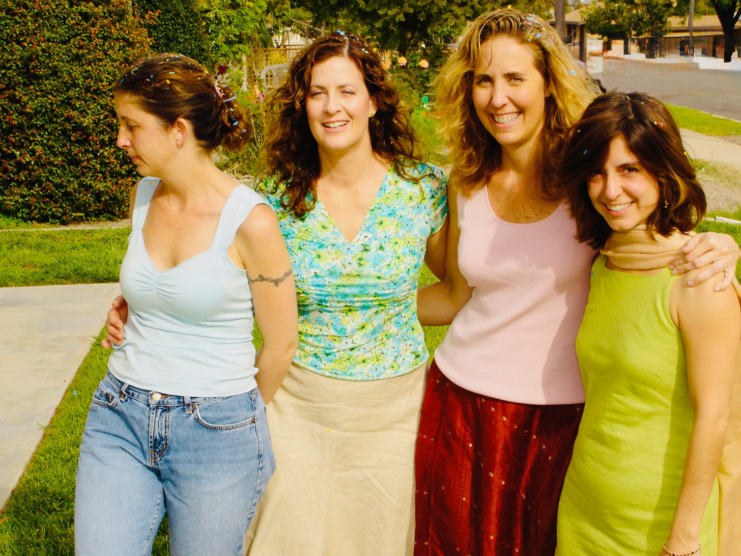 Four girls with confettin in their hair on a Sunday Easter morning celebration Four girls with confettin in their hair on a Sunday Easter morning celebration
