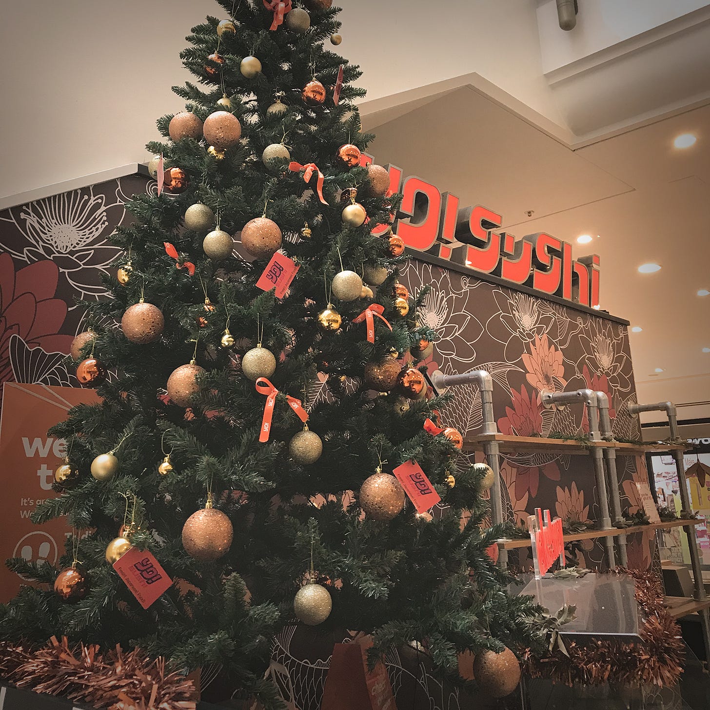 Christmas tree in front of a branch of Yo Sushi