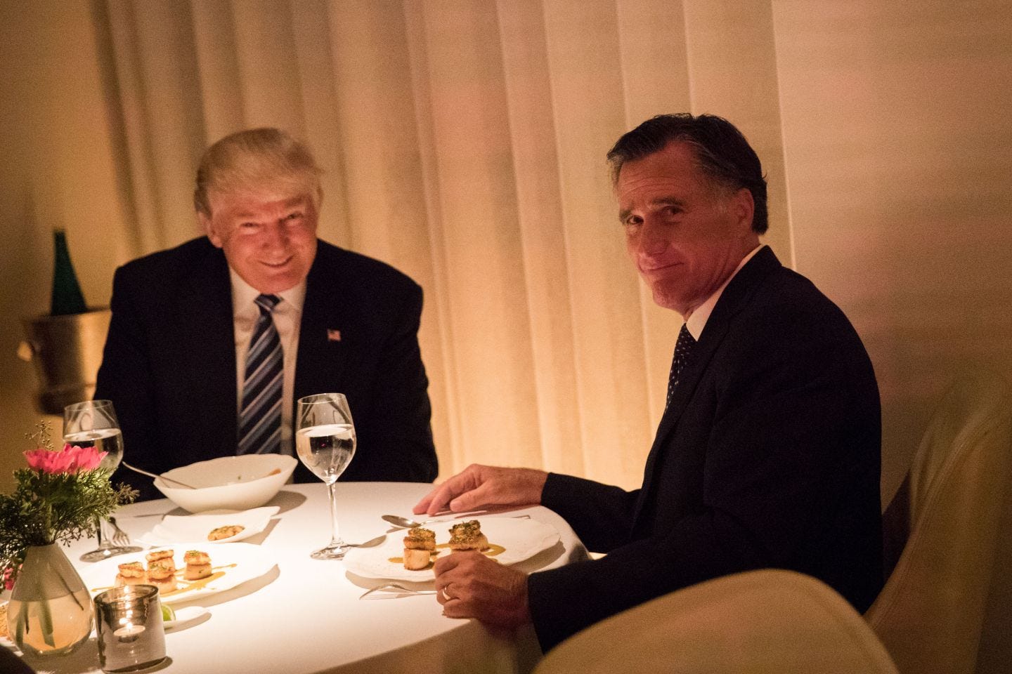 This image may contain Mitt Romney Tie Accessories Accessory Human Person Sitting Suit Coat Clothing and Overcoat