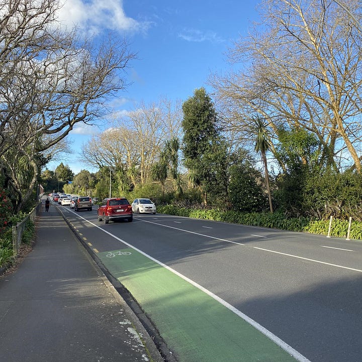 Left: A photograph taken from the west side of Victoria Bridge, looking east. You can see painted cyclelanes on both sides, a footpath on the north side of the bridge, and two lanes of traffic in the middle. Right: An old black and white photograph of the bridge, taken from the north west shores of the Waikato River. The bridge looks basically the same, but the landscaping under the bridge is very different.