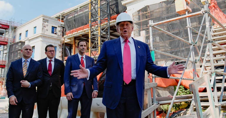 U.S. President Donald Trump speaks to the media during a tour of the Federal Reserve Board building, which is currently undergoing renovations, in Washington, D.C., U.S., July 24, 2025. 