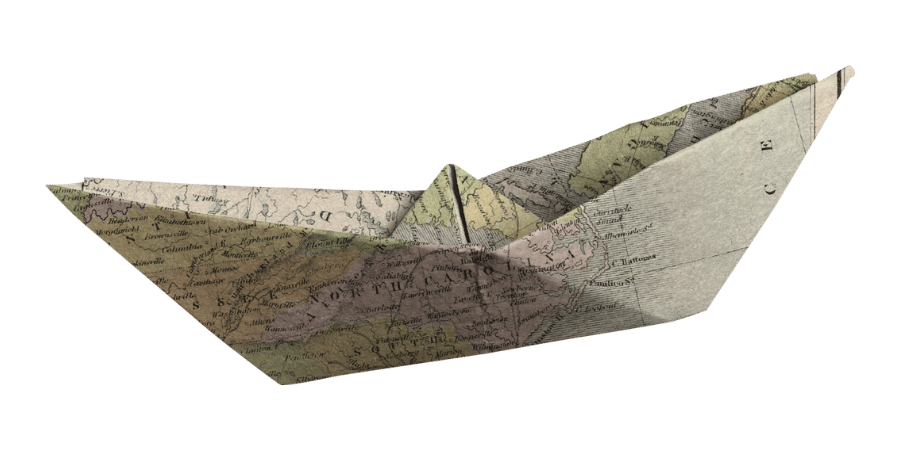 paper origami boat made from an old map