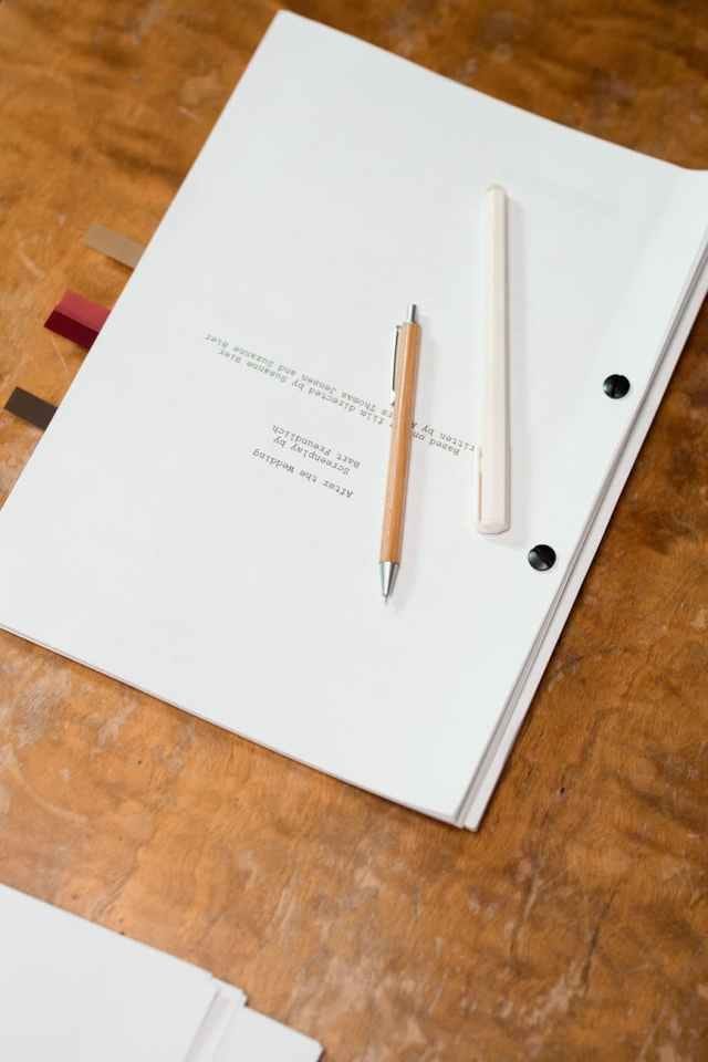 pens over a bind manuscript