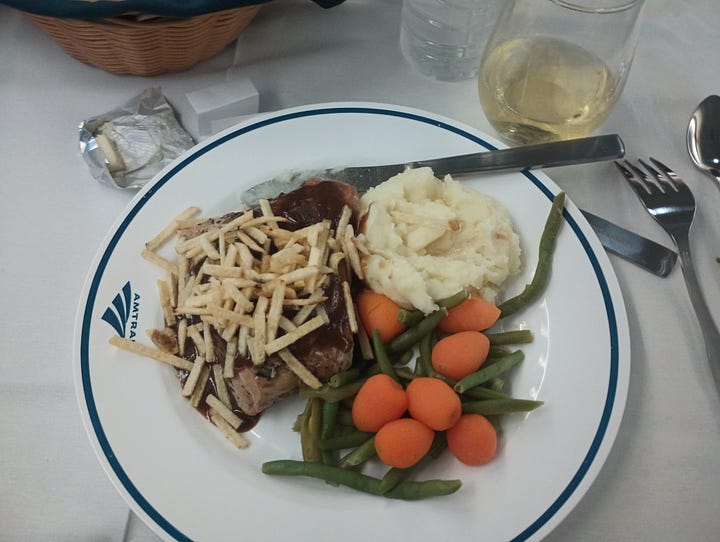 Bunn coffee maker, looking down the dining car on one train, looking down another dining car, the menu, chicken dinner on the train