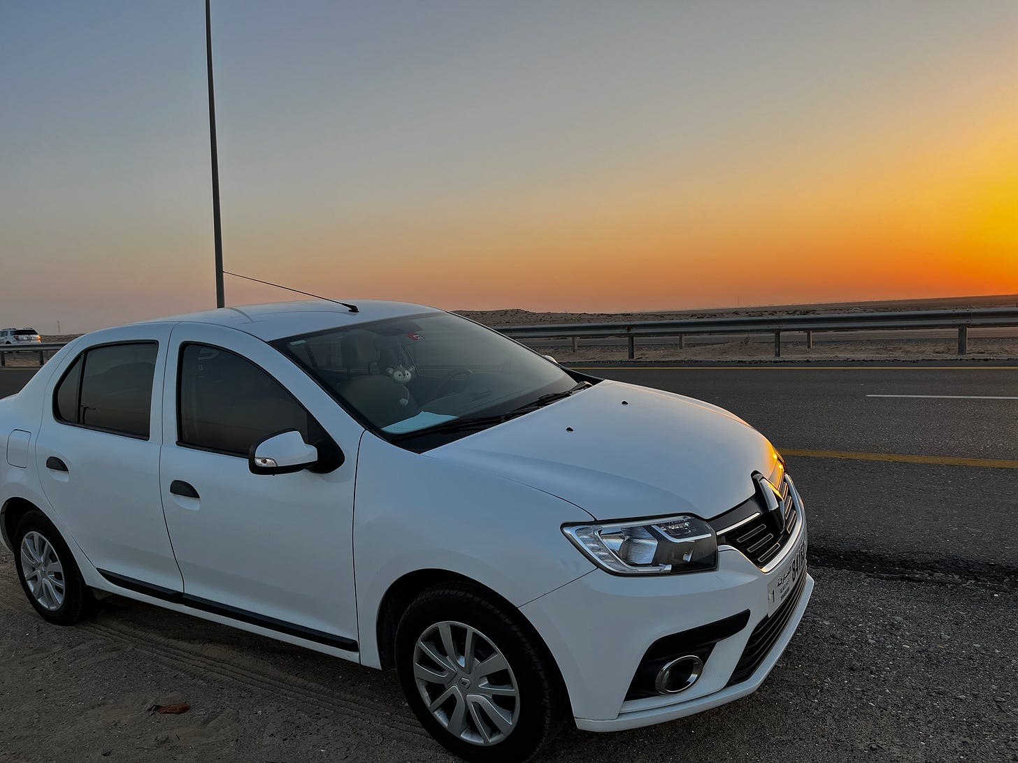 A picture of my car, Boo, in happier times. Standing by the side of the road, ready to go.