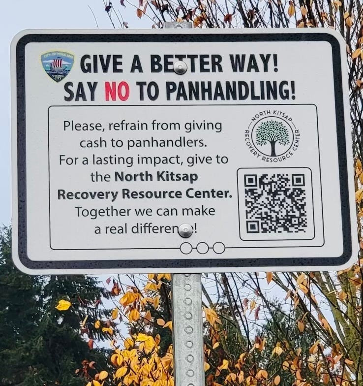 A sign on a pole
Description automatically generated A sign on a pole
Description automatically generated