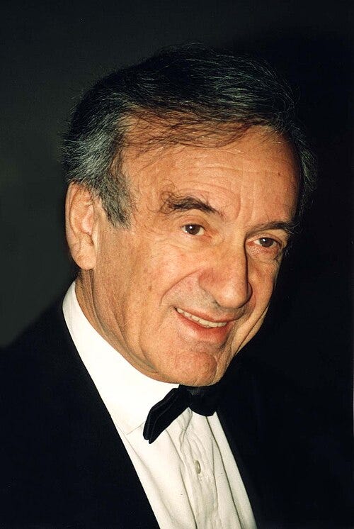Elie Wiesel in 1996 wearing tuxedo; hair gray and thinning, smiling, two thirds profile. Elie Wiesel in 1996 wearing tuxedo; hair gray and thinning, smiling, two thirds profile.