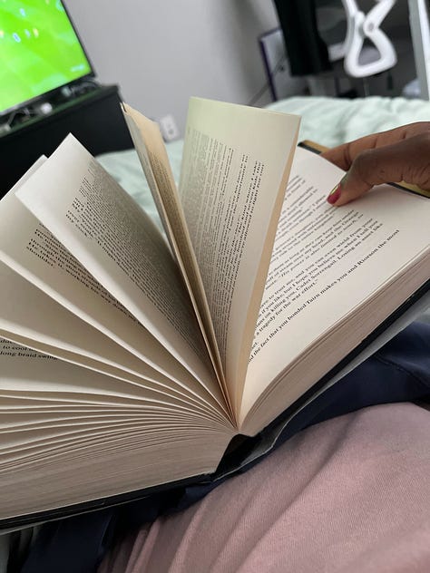 Image 1: Black and white panoramic photos documenting American history through the 70's|| My Apple Watch that I bought from the Carnegie Store|| Opened copy of Fourth Wing while I was reading it || An old Panoramic camera|| Negative film of a photo lined up with it's print|| the welcome area at the Apple store where people learn about Apple products