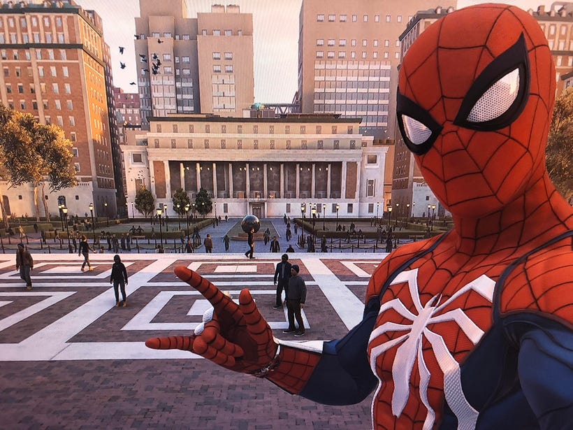 Spider-Man stands in front of the Columbia campus