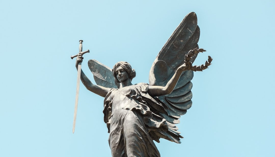 a statue of an angel holding a sword