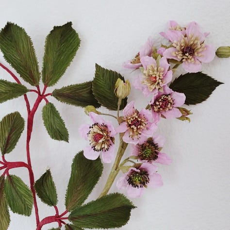 Image one: a study of brambles and paper experiments of different fringes to build the complex centre. Image two shows an enlarged bramble stem I created in 2020 and Image three shows the bramble stem from this week, closer to life size, showing how my work has developed.