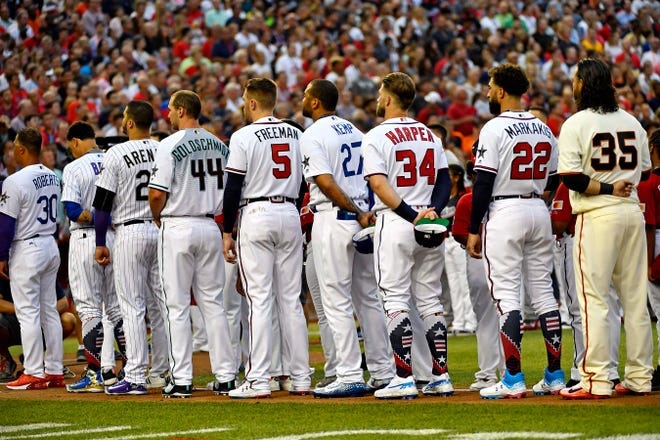 The National League team stands during national anthem before the 2018 MLB All Star Game.