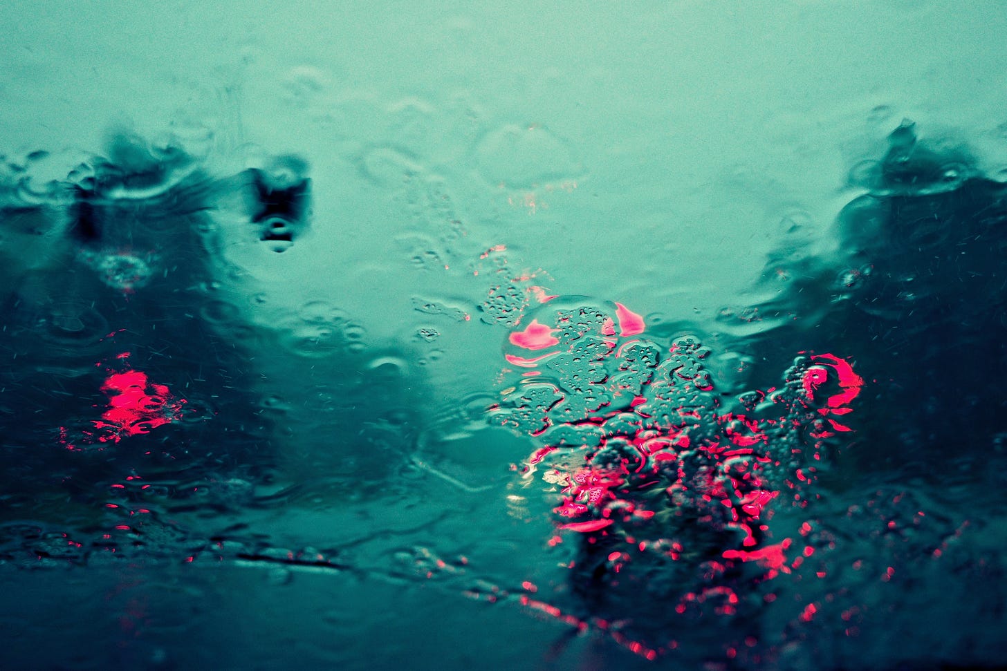Cars and stoplight through a windshield