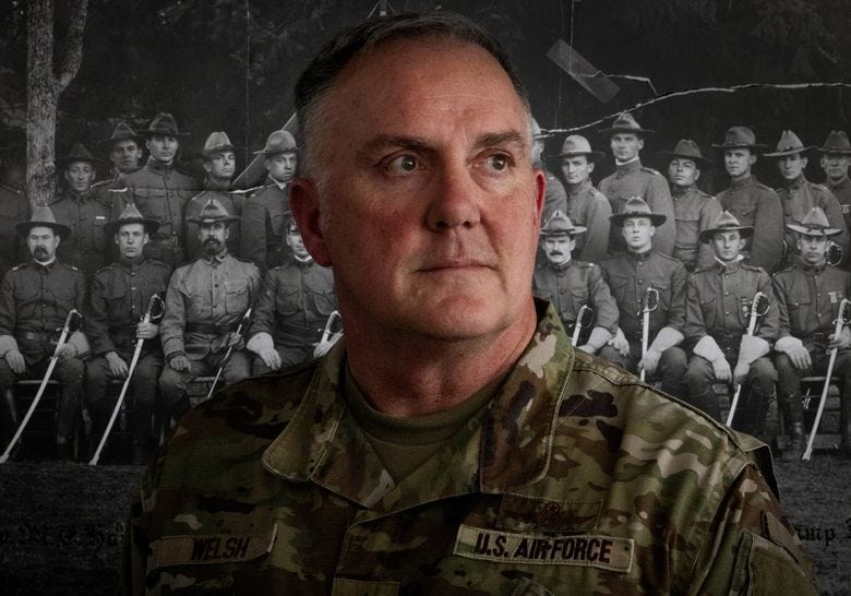 Maj. Gen. Gent Welsh, commander of the Washington National Guard, keeps a 1911 photo of the state’s national guard with swords, in his Camp Murray office, Wednesday, Oct. 8, 2025, in Lakewood.  (Ken Lambert / The Seattle Times)