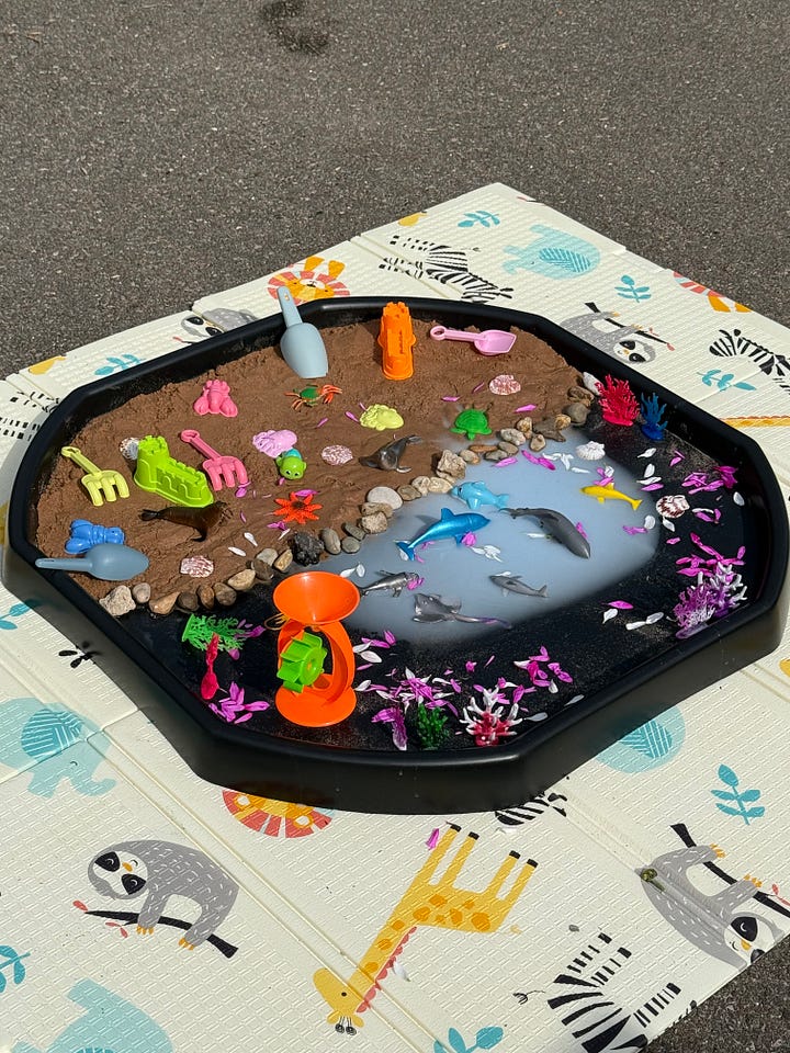 Sensory play trays with different natural playscape themes and materials