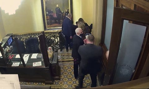 Vice-President Mike Pence is captured on security video being evacuated as rioters breach the Capitol on 6 January 2021. Vice-President Mike Pence is captured on security video being evacuated as rioters breach the Capitol on 6 January 2021.