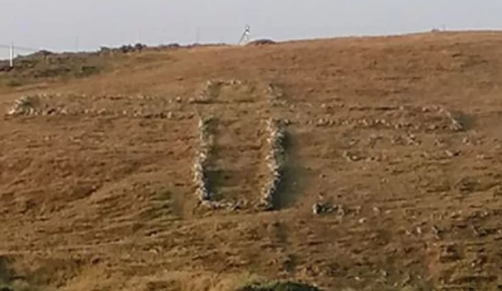 A stone wall on a hill

AI-generated content may be incorrect.