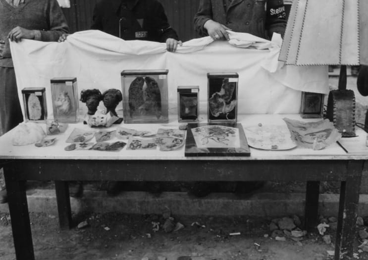 A table with a table with objects on it

AI-generated content may be incorrect.