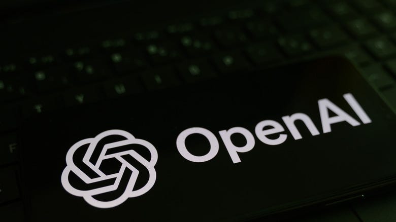 OpenAI logo against a keyboard OpenAI logo against a keyboard