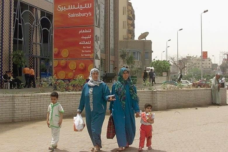 May be an image of 8 people, child, people standing, headscarf and outdoors