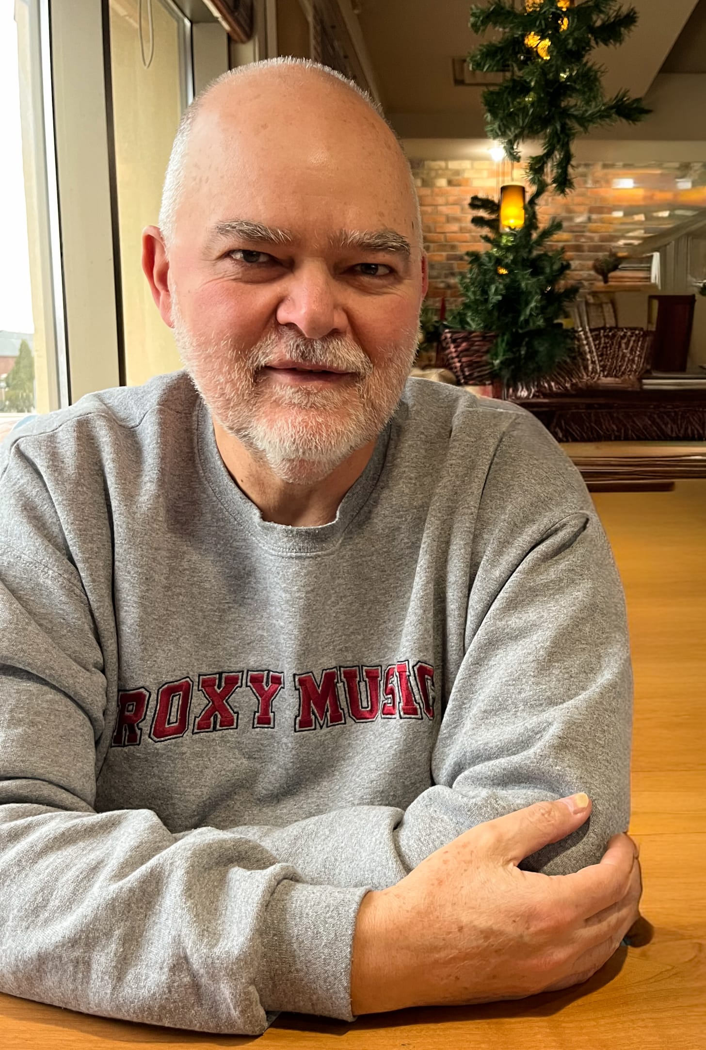 Don Pyle wearing a grey Roxy Music sweatshirt.