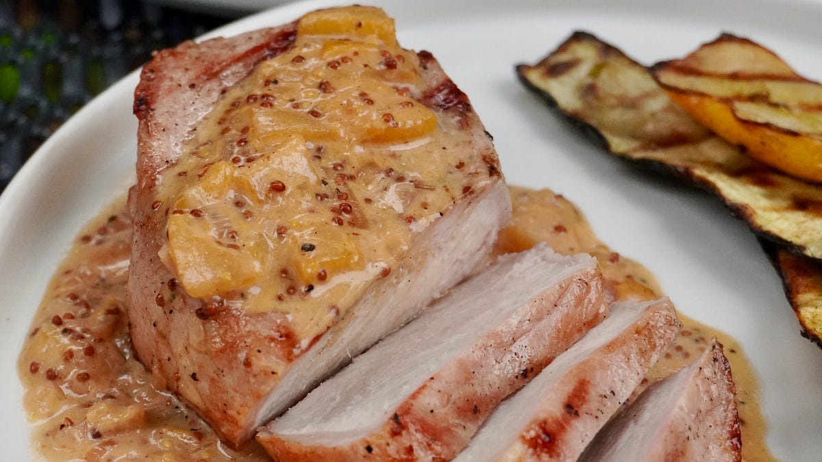 Grilled pork chops with creamy Dijon peach barbecue sauce