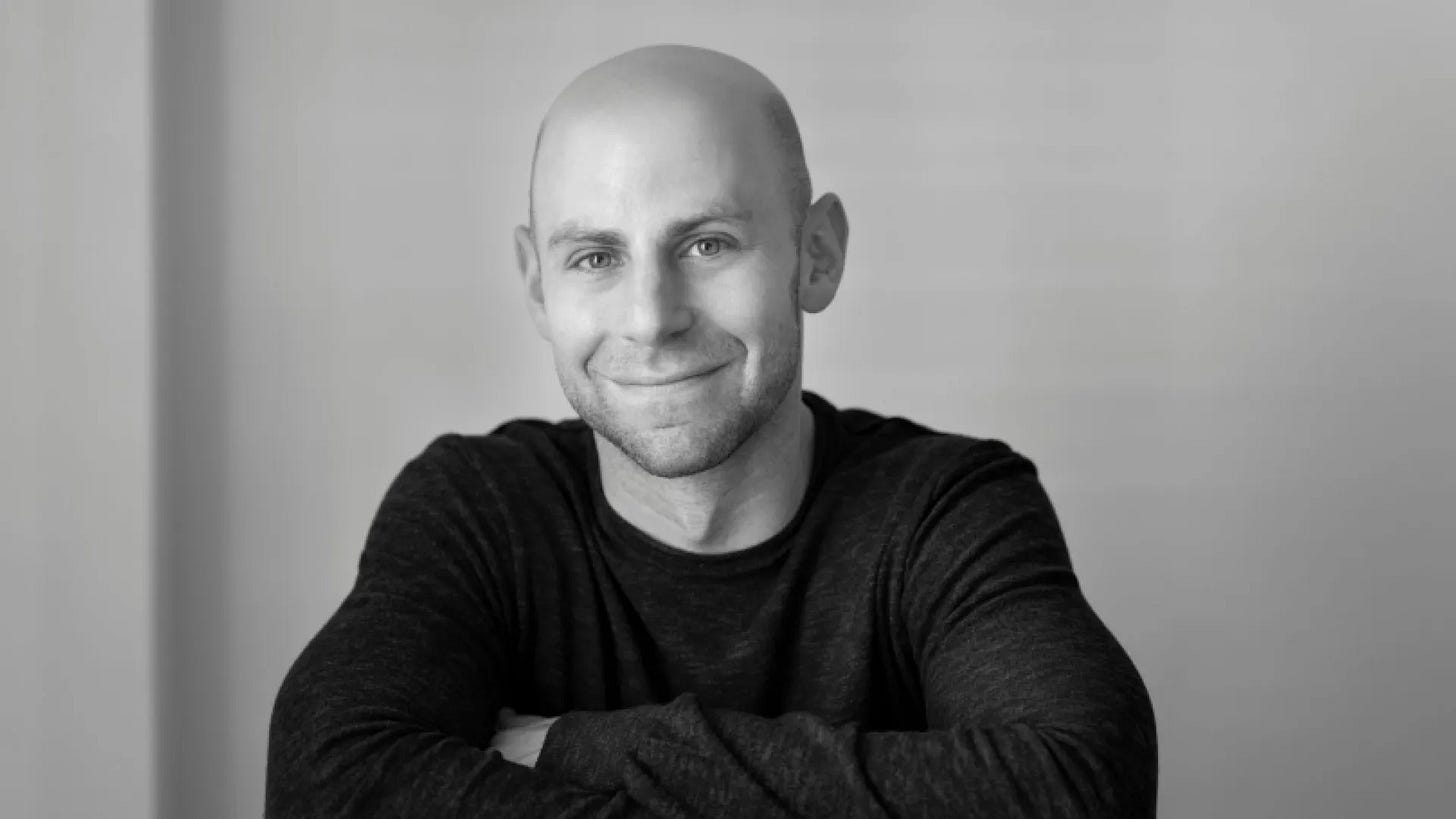 Black-and-white portrait of Adam Grant.